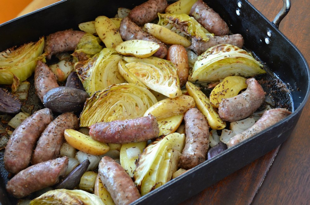 Just toss sausages, onions, potatoes, cabbage, and a few simple flavorings ...